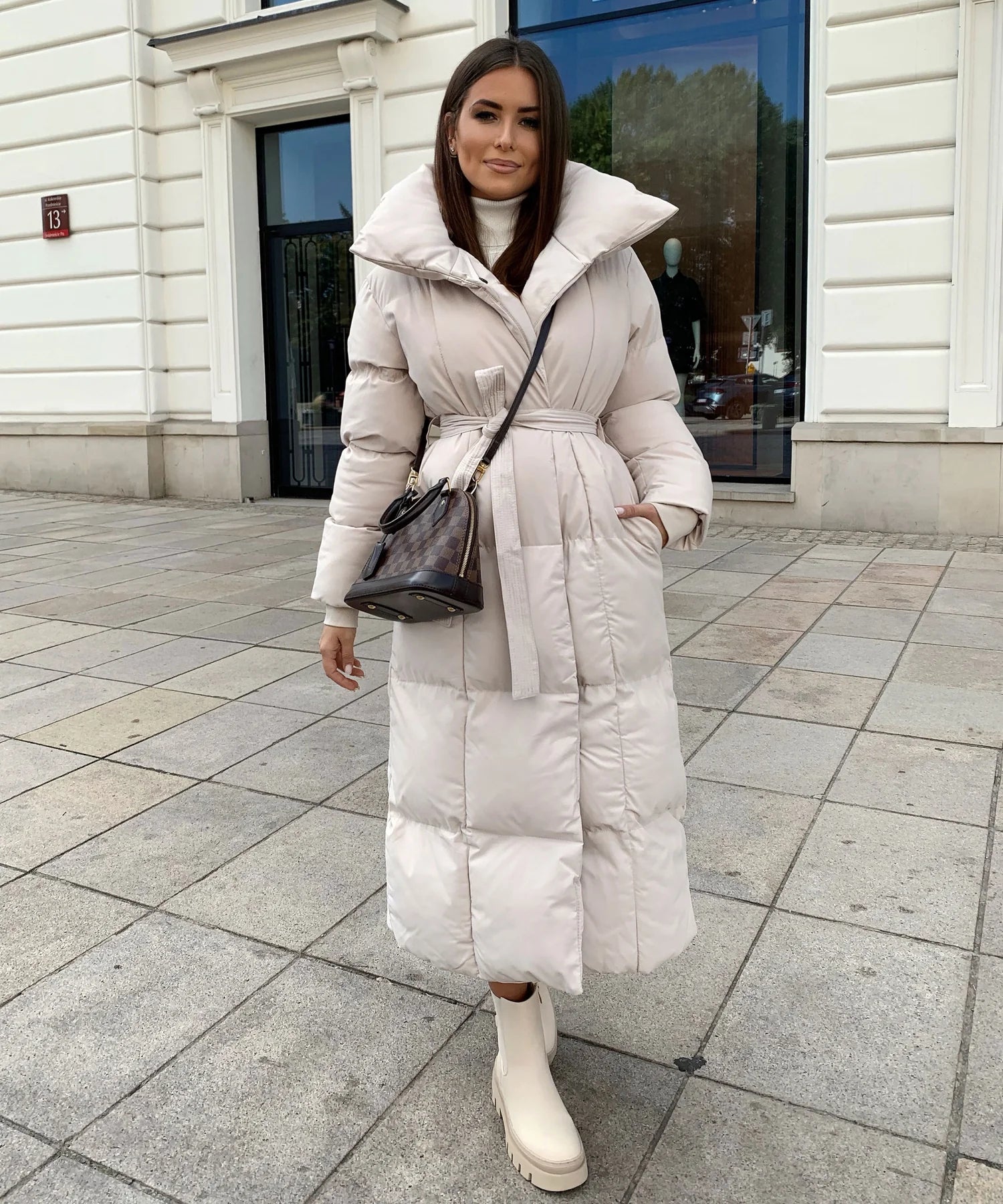 Elegant long winter coat with adjustable belt for optimal comfort Sutton James