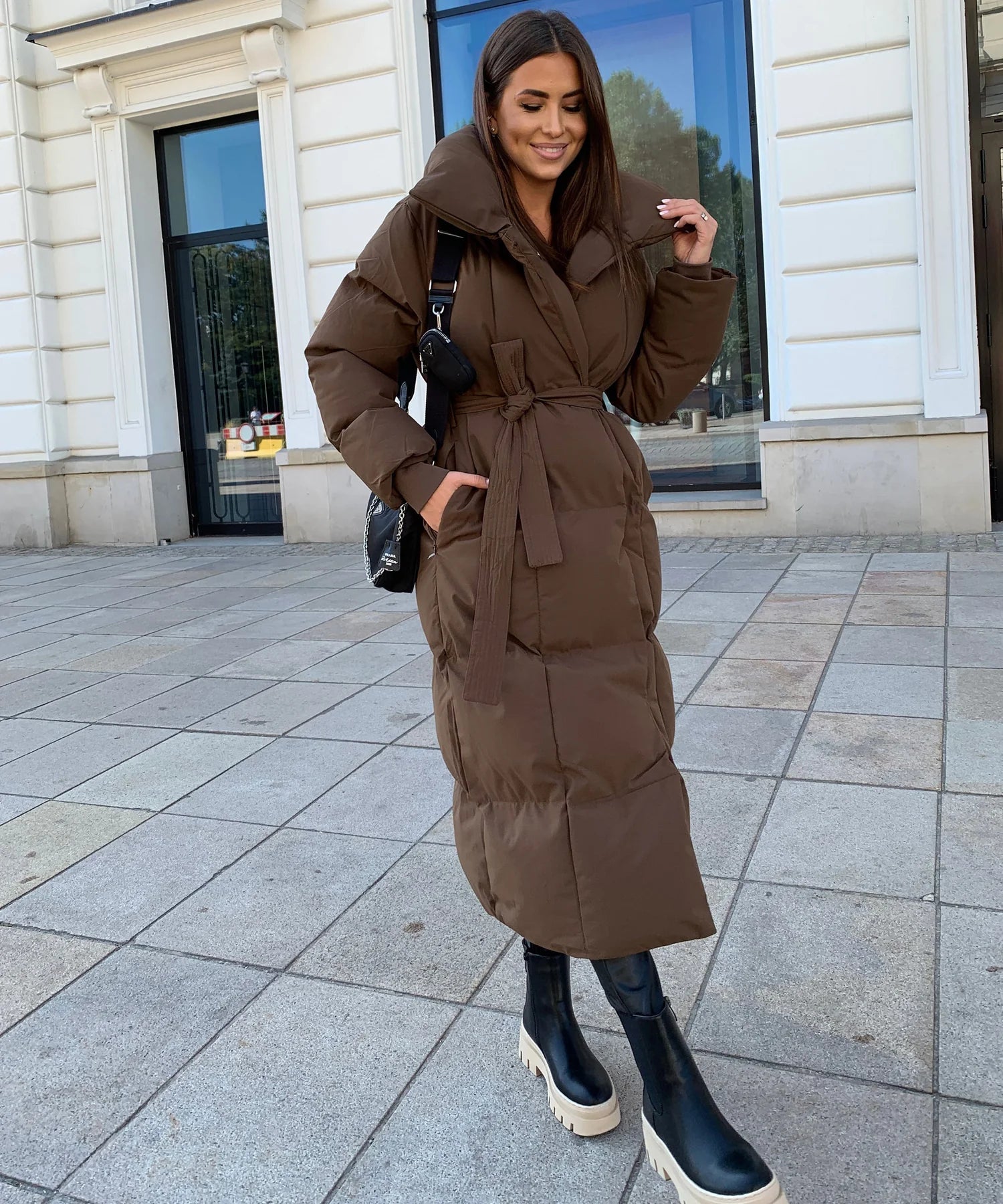 Elegant long winter coat with adjustable belt for optimal comfort Sutton James